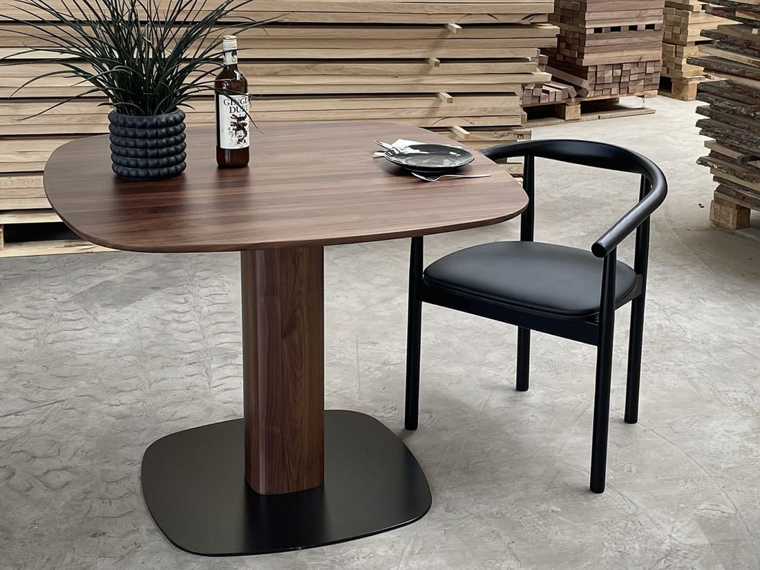 Solid walnut dining table, photographed at the workshop